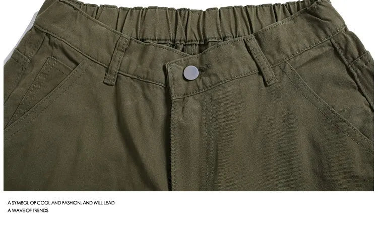 Women's loose fit cropped workwear pants with wide-leg design and rivet detailing