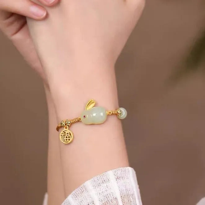 Yellow string bracelet with a geometric Hetian jade rabbit charm for women.