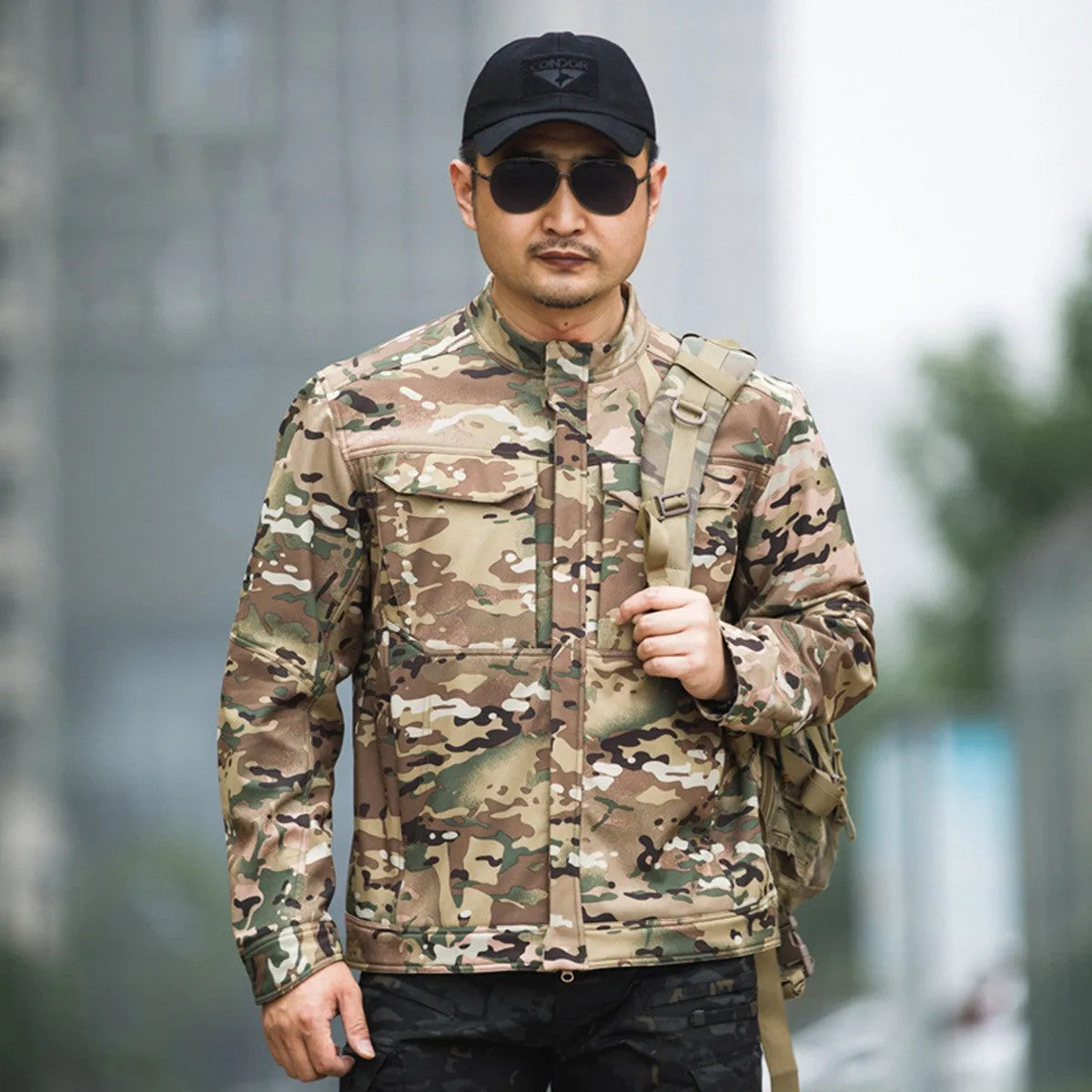 Soft shell tactical jacket for mountaineering and camping in black camouflage colour