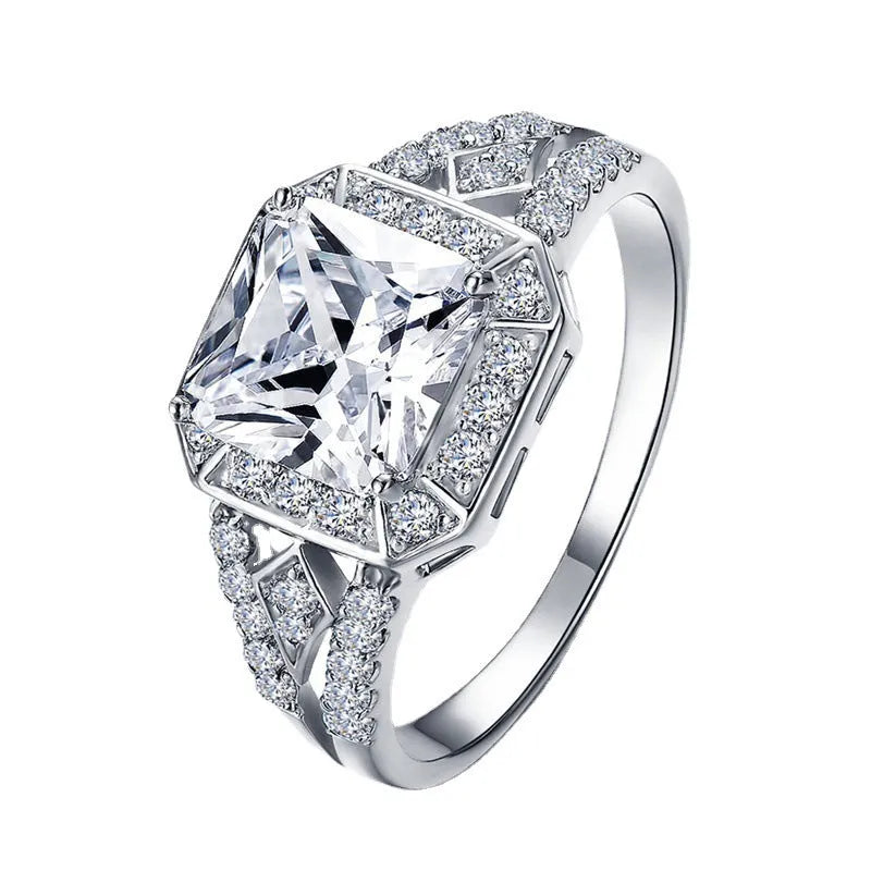 Women's platinum colour geometric zircon ring with hollow ornament design showing quadrilateral pattern