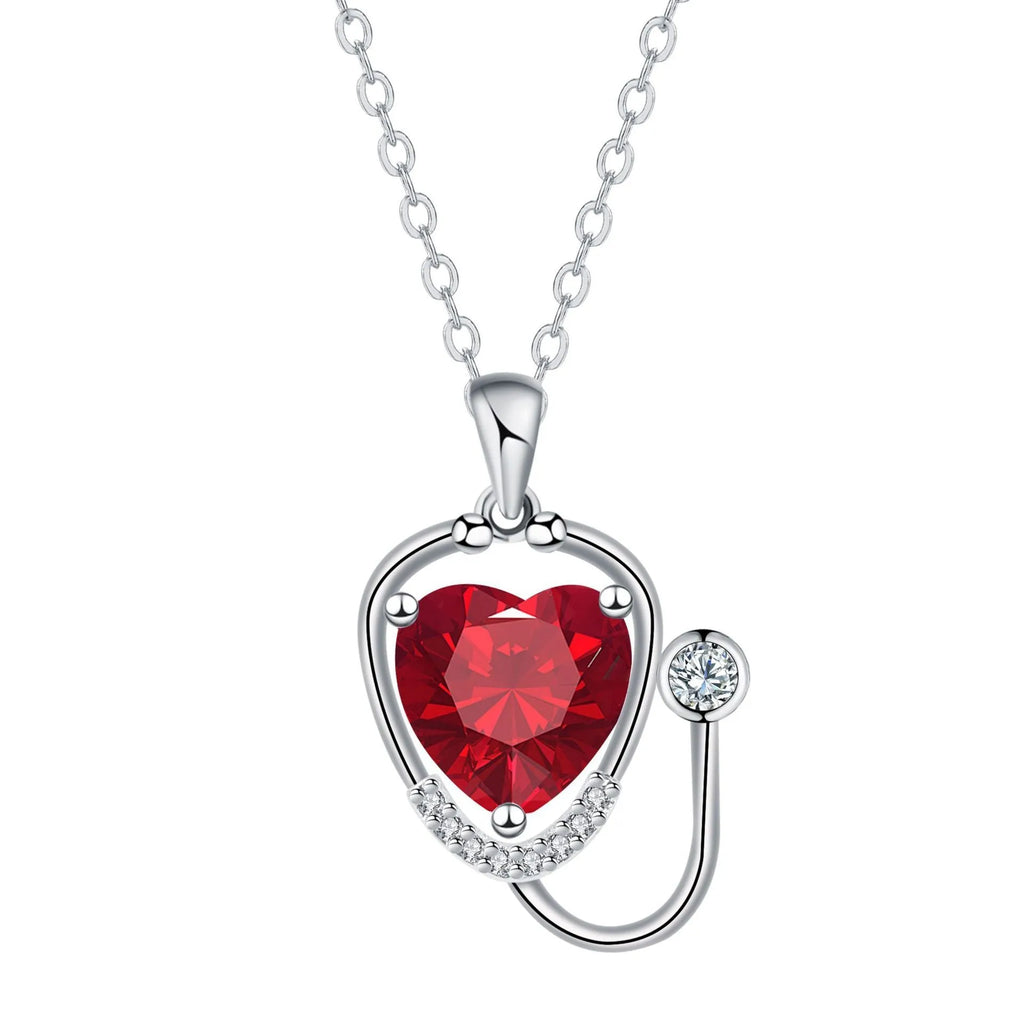 Red diamond coloured women's necklace with stethoscope, wings and cross pendant design