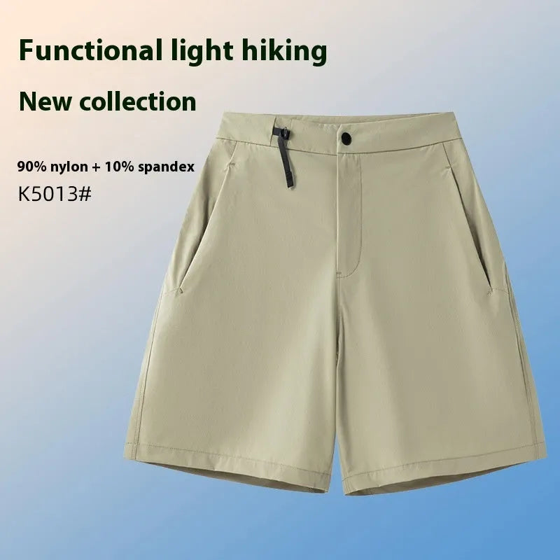 Man wearing khaki quick-drying sports shorts with an elastic waistband for running or climbing.