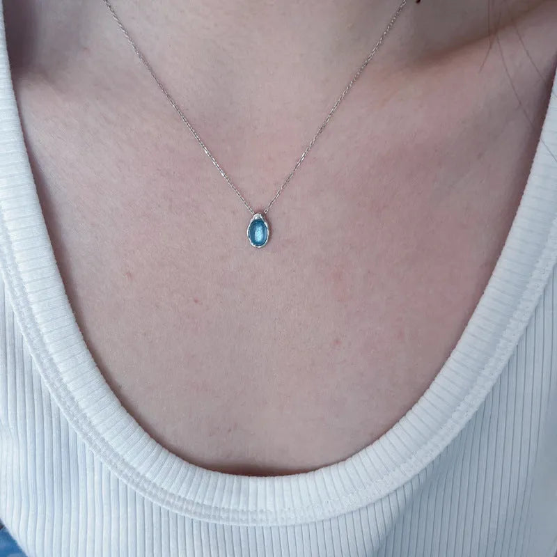 Navy blue water drop necklace with cross chain design in platinum colour, adjustable 41-50cm length