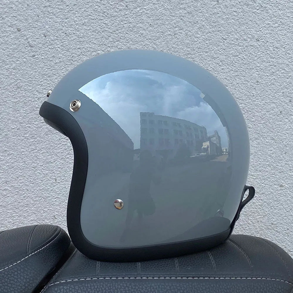 Glass fibre retro motorcycle half helmet shown in cement grey colour on size M