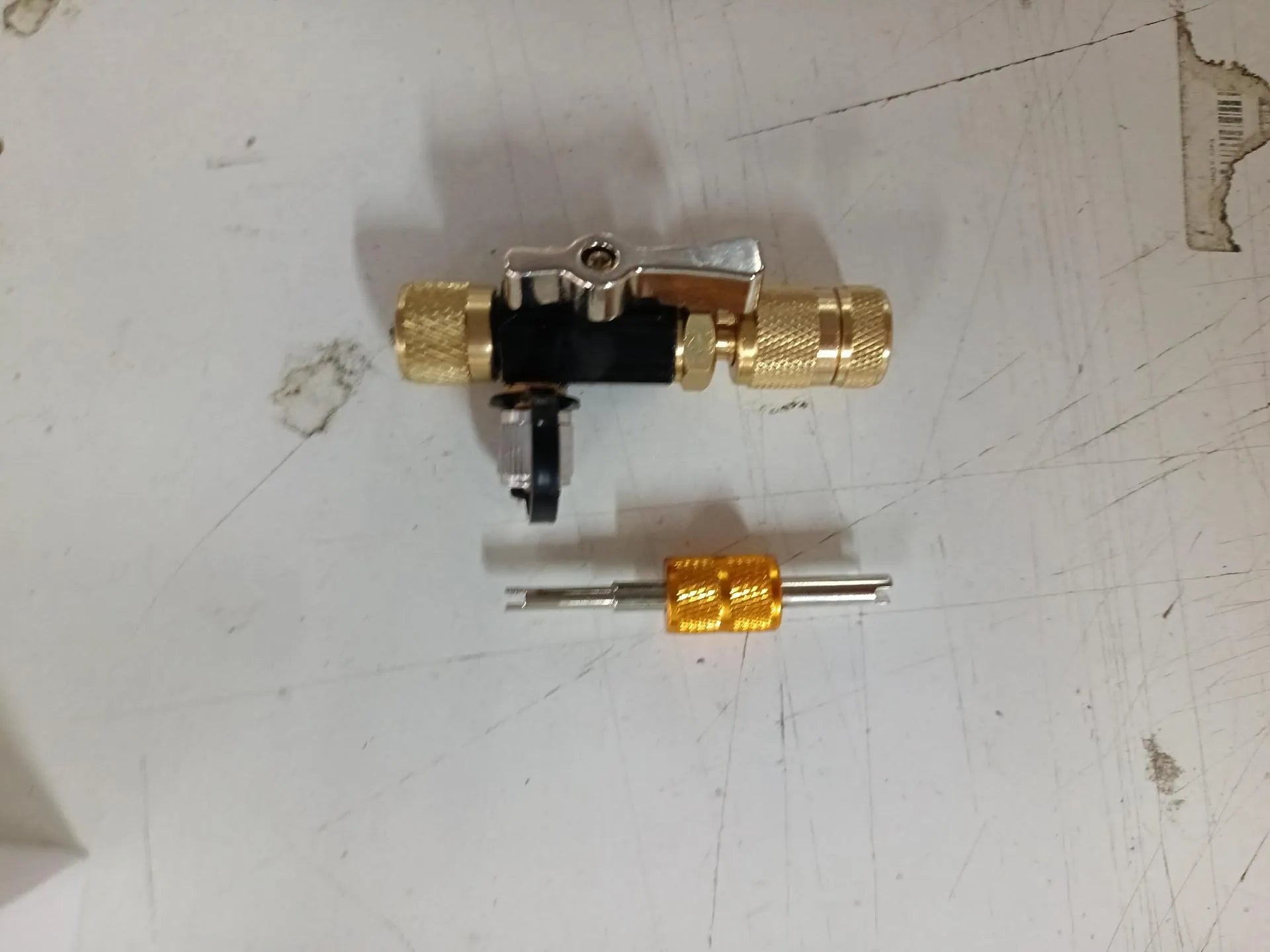 Vacuum valve core disassembly tool set showing four style options with black and pink valve removers