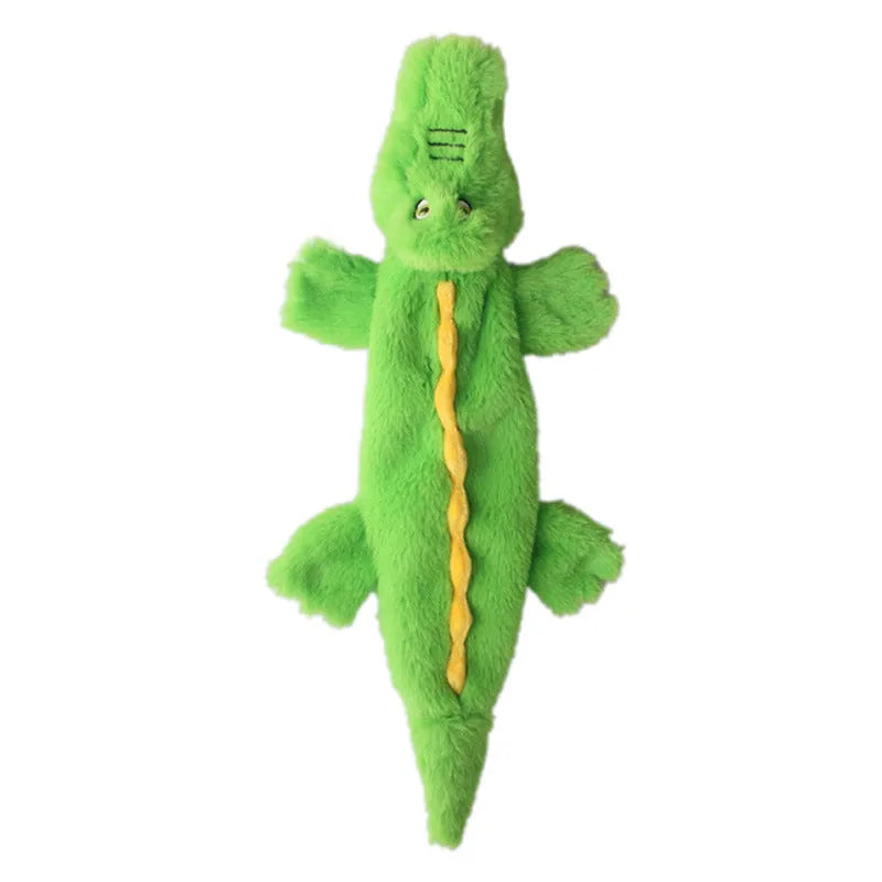 Green crocodile-shaped plush dog toy with no stuffing, featuring a squeaker and crinkle paper for interactive play.