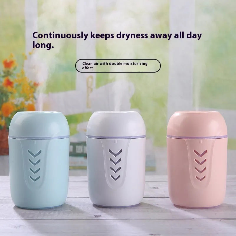 Compact round USB portable air purifier in blue, pink, or white for car and desktop use.