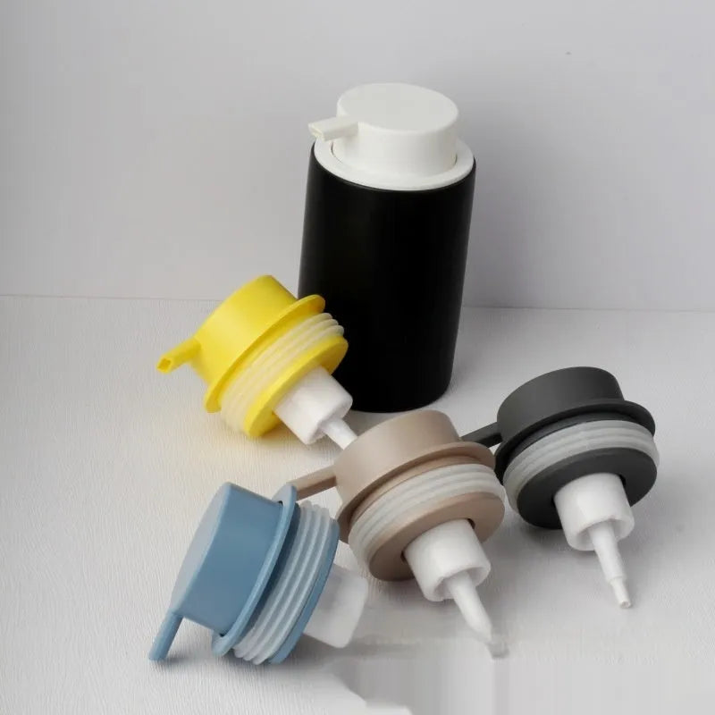 Foam pump dispenser with large head in metallic gold finish for facial cleansers and shower gels
