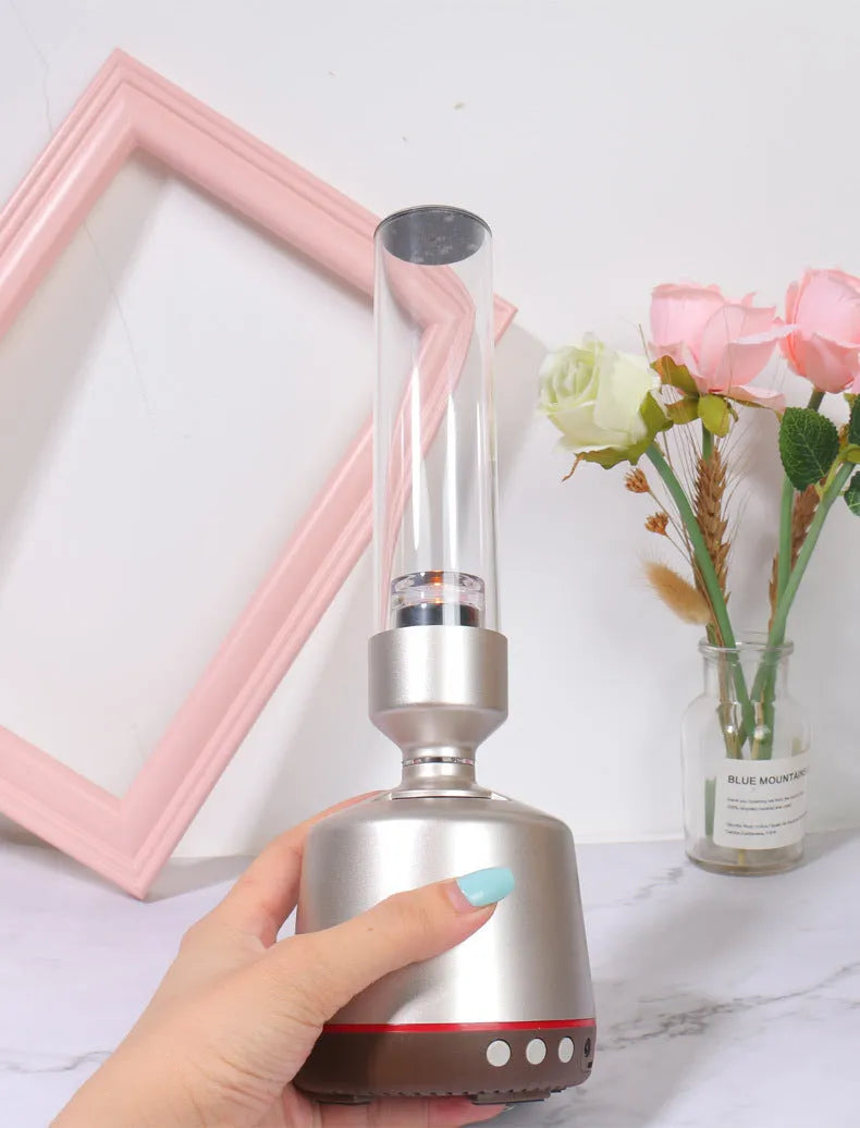 White silver Bluetooth speaker with candlelight-style night light function