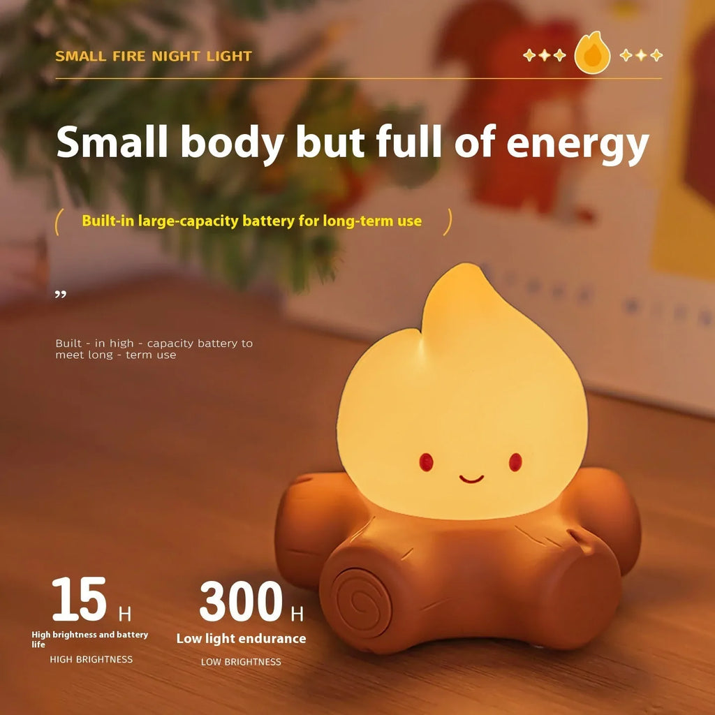 Small cartoon silicone fire pile night lamp with yellow glow on a surface