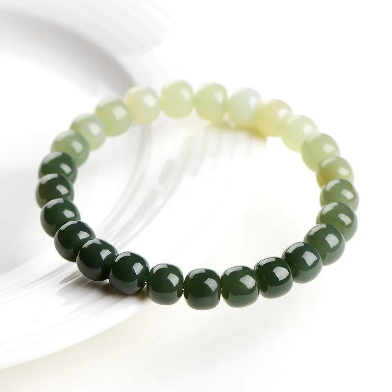 Natural Hetian jade bracelet showing water gradient colour on polished beads