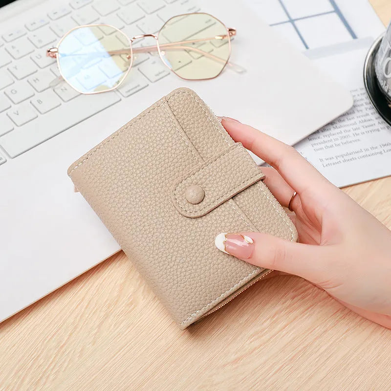 Ladies short wallet with lychee pattern in beige pink black or red colours showing 2-fold design