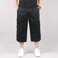 Man wearing loose-fit khaki cotton cropped casual shorts for sports.