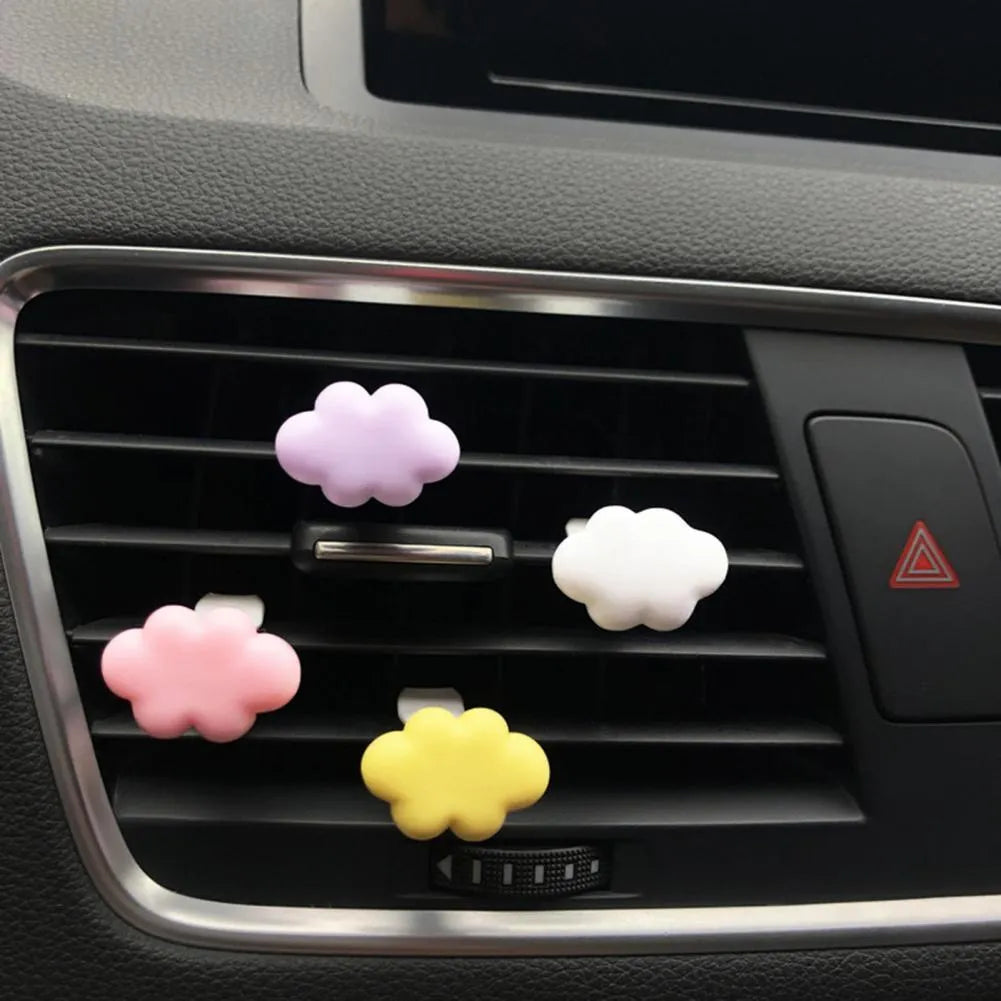 Resin car fragrance clip with Baiyun cartoon cloud design mounted on car air vent