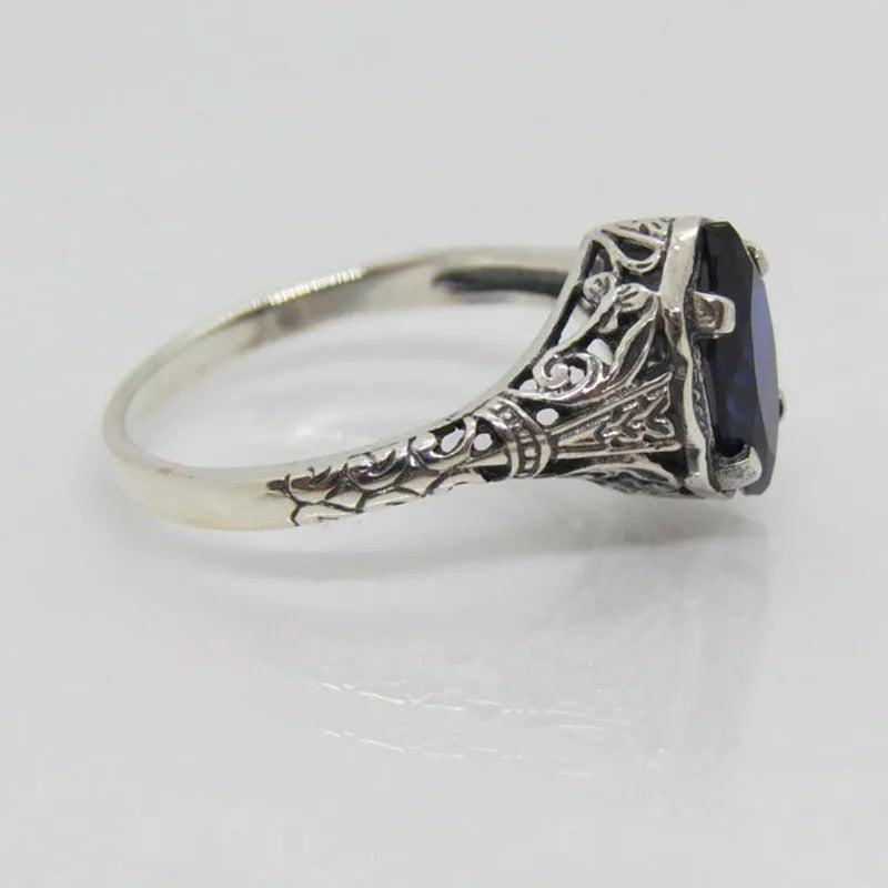 Silver women's ring with geometric hollow pattern, shown in size US7.