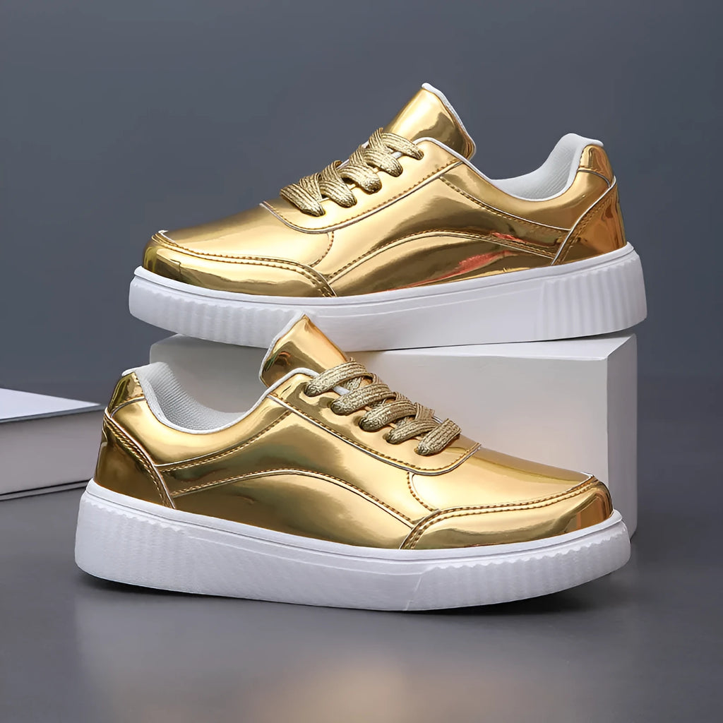 Gold platform sneaker with sequin upper and thick MD sole on a white background.