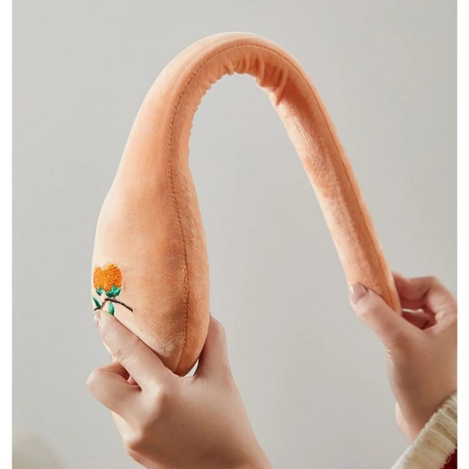 48 cm persimmon coloured back pounding percussion therapy stick with meridian flap design