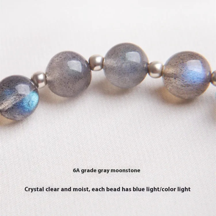 Women's crystal bracelet with 7.5mm beads and silver honeysuckle charm