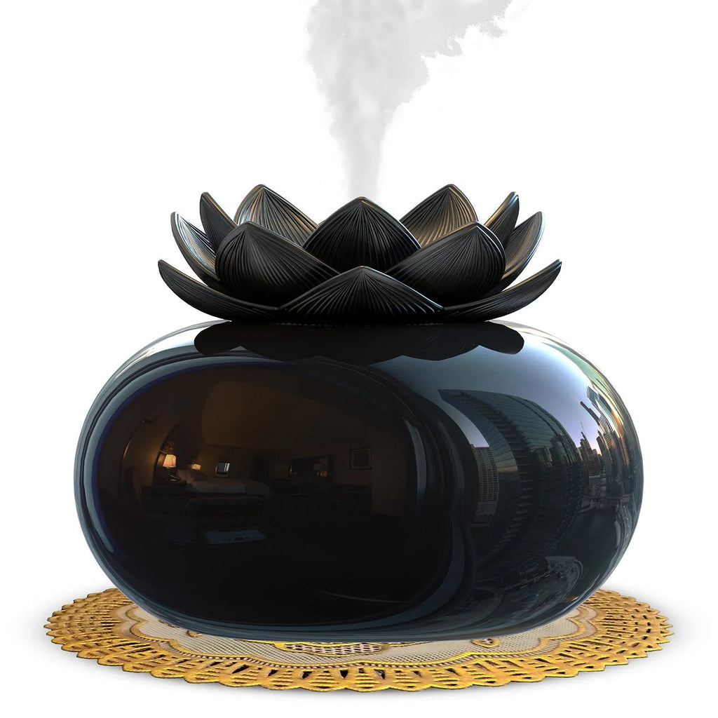 Pure black round USB aromatherapy humidifier on a surface