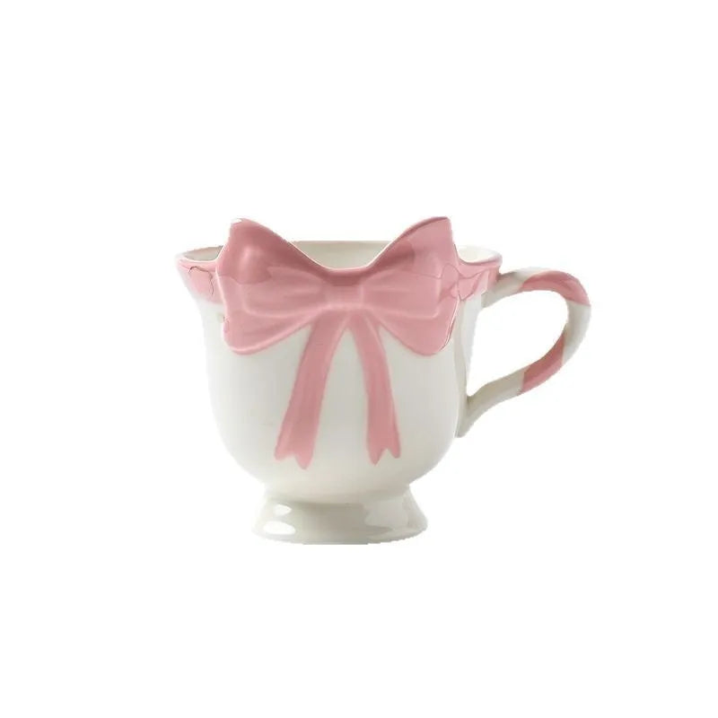 Ceramic heart bow design mug in white powder or black pink colour with 301-400ml capacity