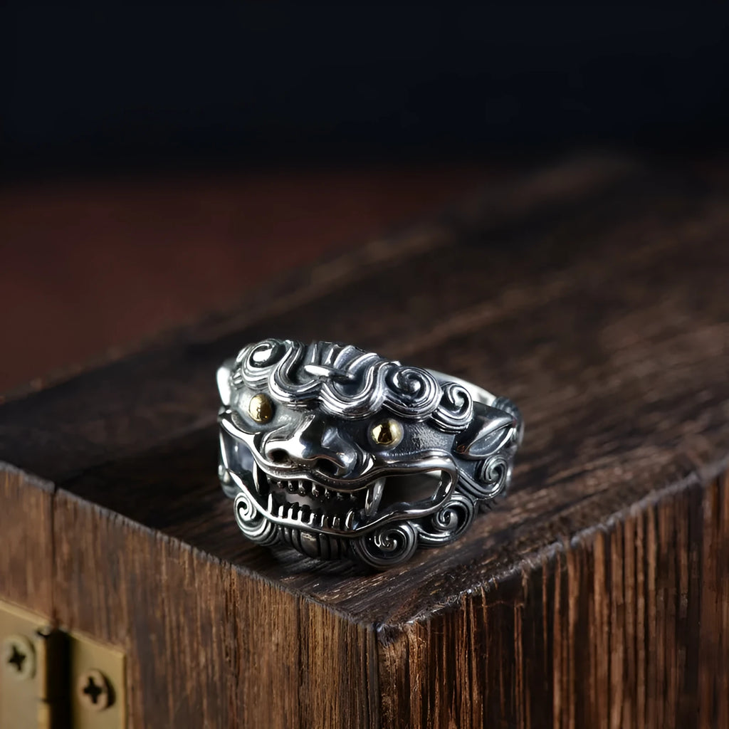 Silver open ring with domineering jibeast pattern showing animal zodiac modelling details