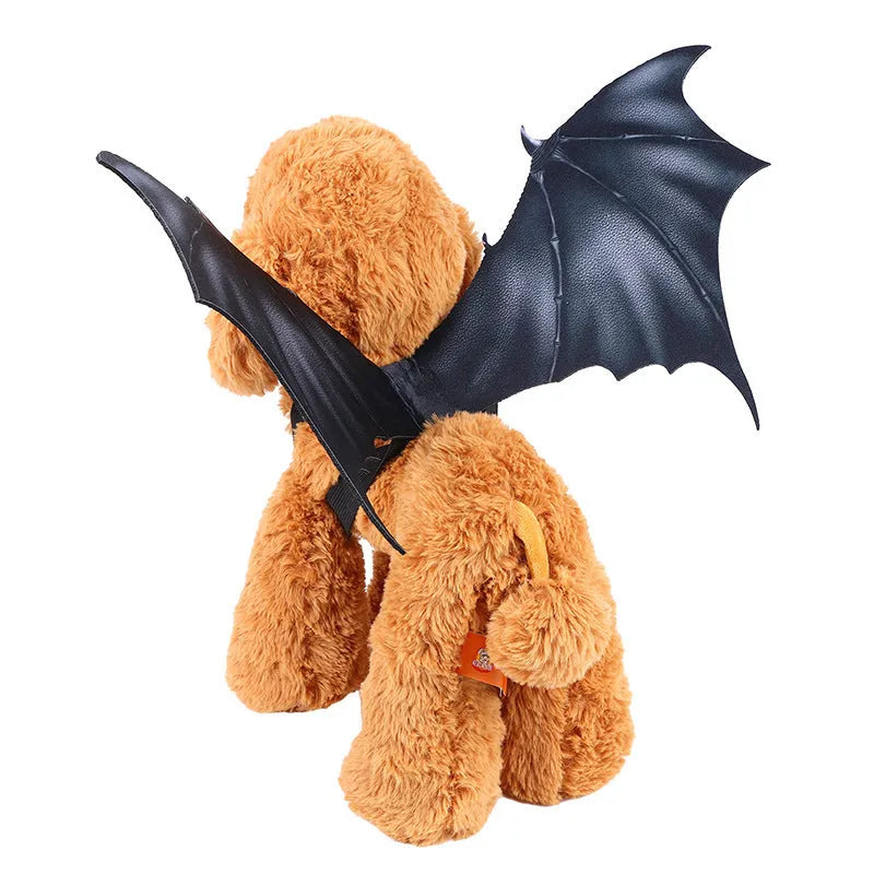 Black cloth bat wing costume for dog or cat on Halloween, shown in three sizes.