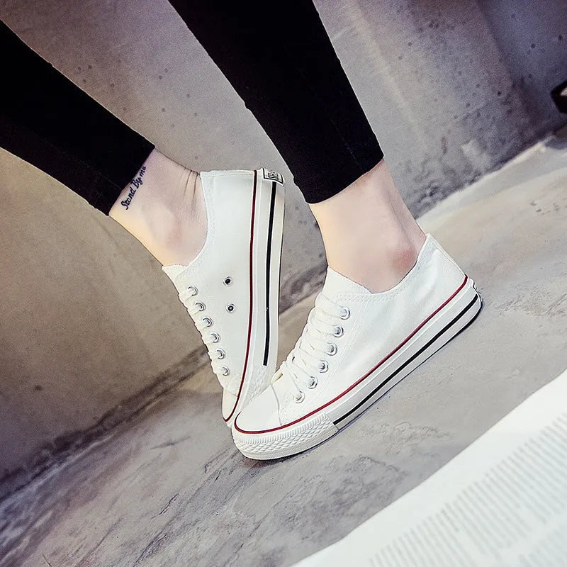 Women's solid colour canvas casual shoes on a plain background, showing the simple design.