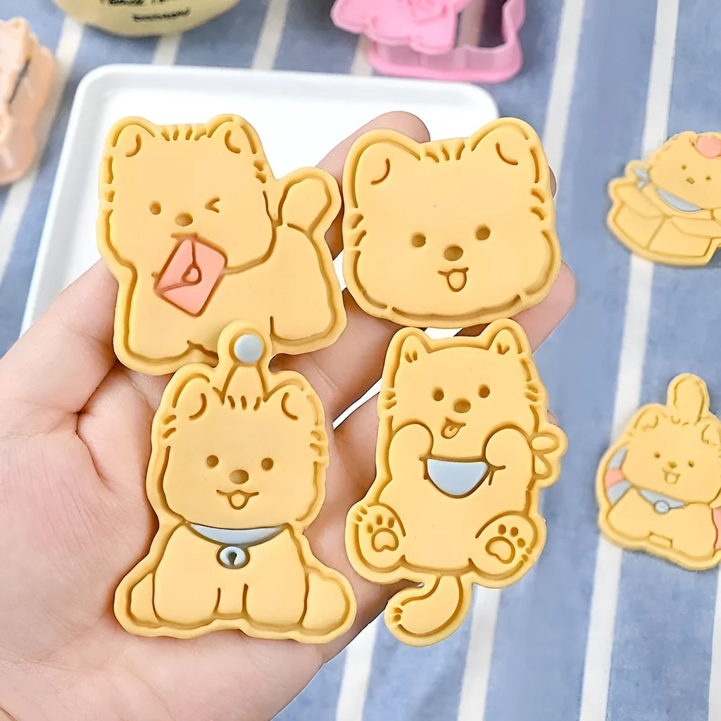 Three dimensional press plastic biscuit mould showing cartoon puppy designs