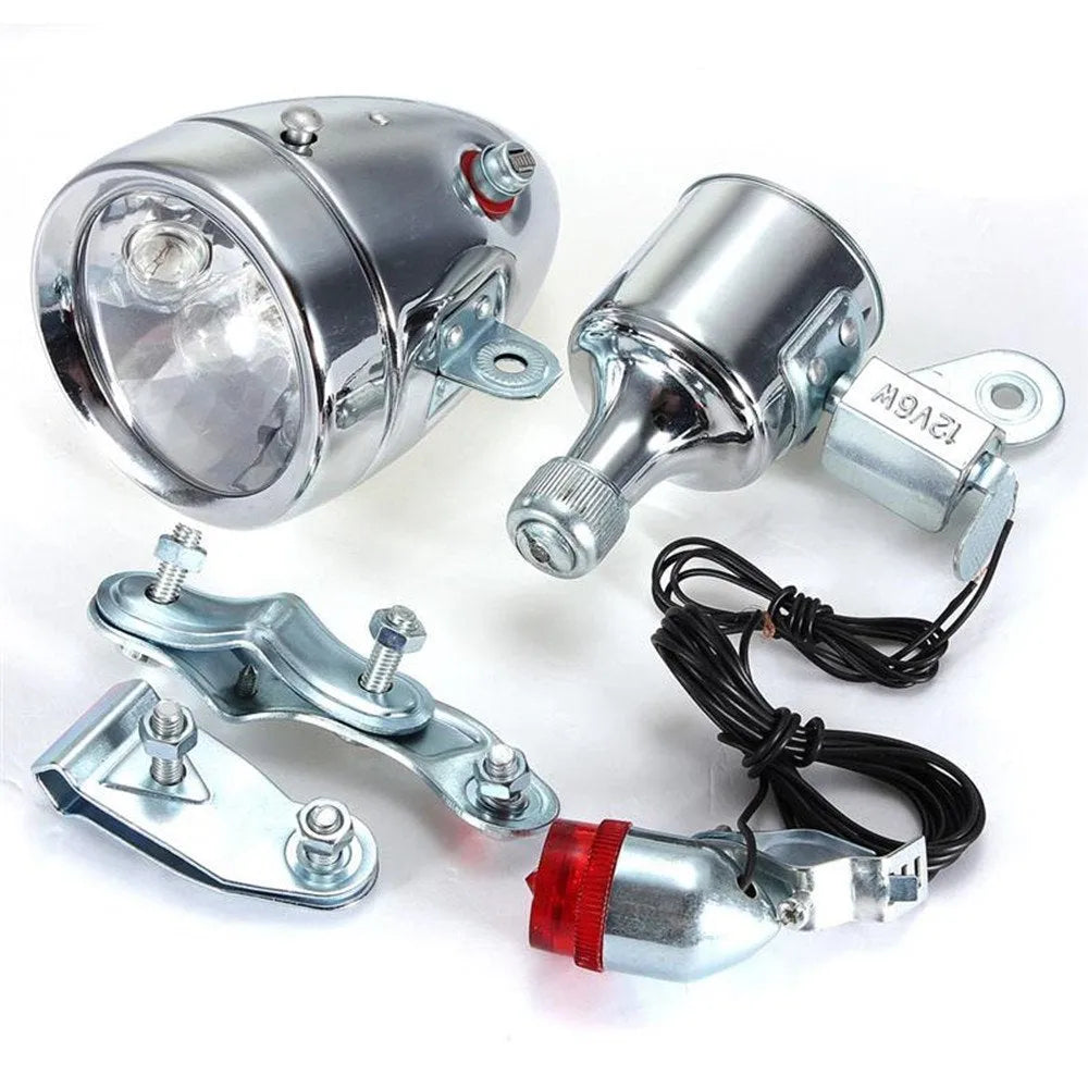 Silver bicycle dynamo-powered light generator kit for front fork or rear frame mounting.