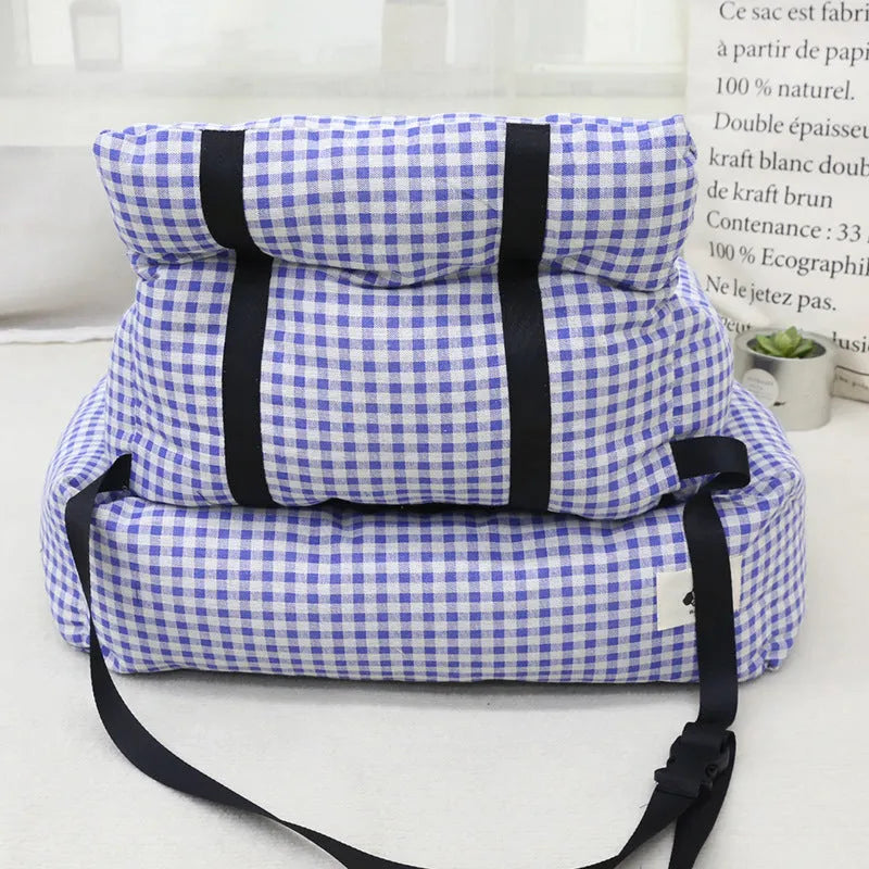 Car-mounted pet travel nest in stain-resistant cloth fabric showing grey and blue plaid options