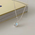 Women's sterling silver geometric stone pendant necklace on a curb chain, adjustable length.