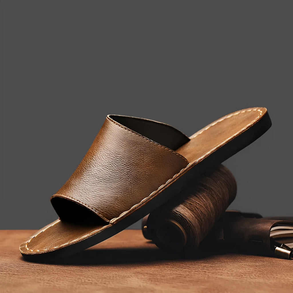 Men's brown leather sandals with rubber soles showing open-toe design