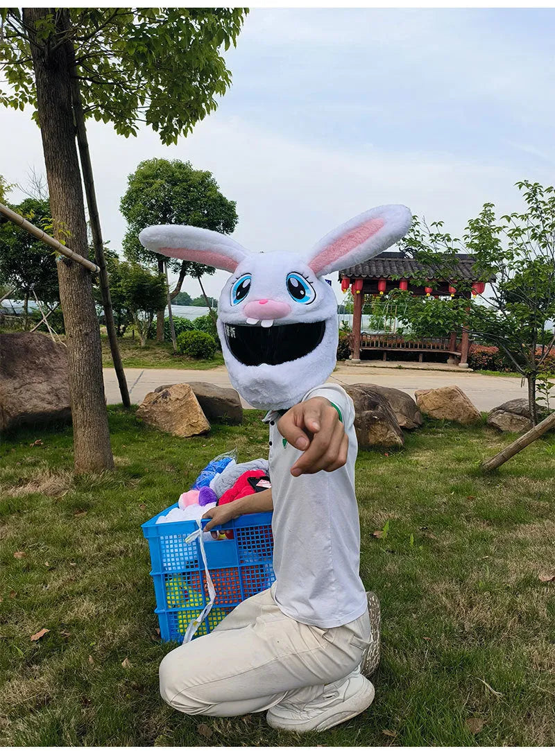 White long-eared rabbit head plush cover on an electric motorcycle helmet.