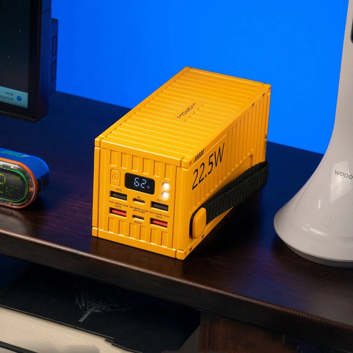 Yellow 50,000mAh power bank with digital display showing battery percentage and five output ports