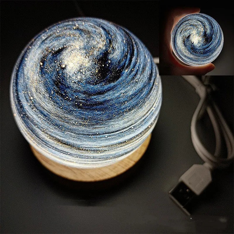 Planet-shaped night light with USB cable and base in modern design, showing 80mm diameter and multiple colour options
