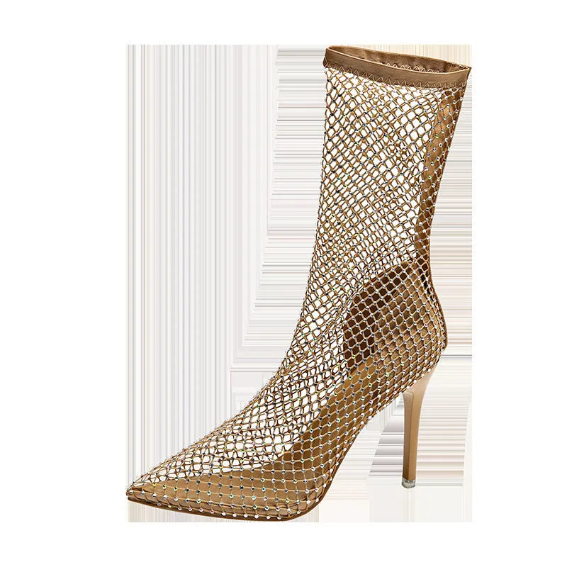 Gold women's high heel sandals with pointed stiletto heel and mesh upper on a rubber sole.