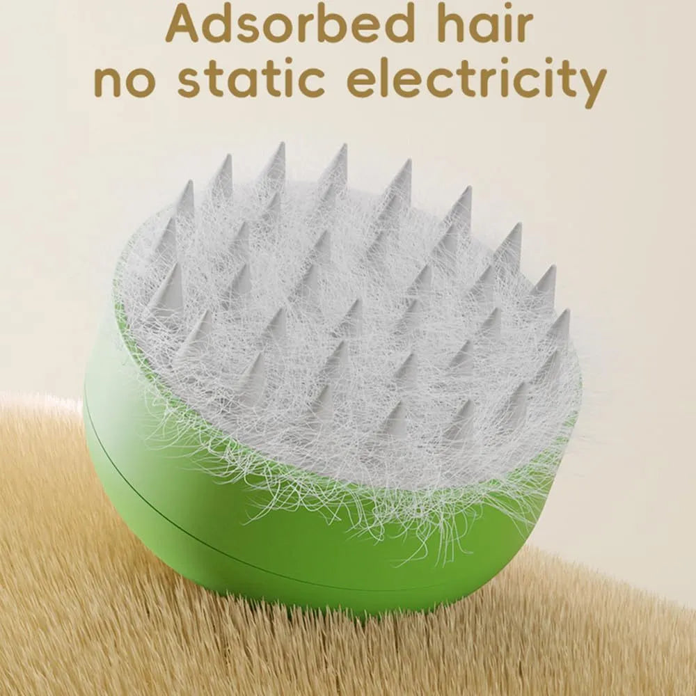 Green and yellow rechargeable cat dog steam brush with silicone head on a white background.