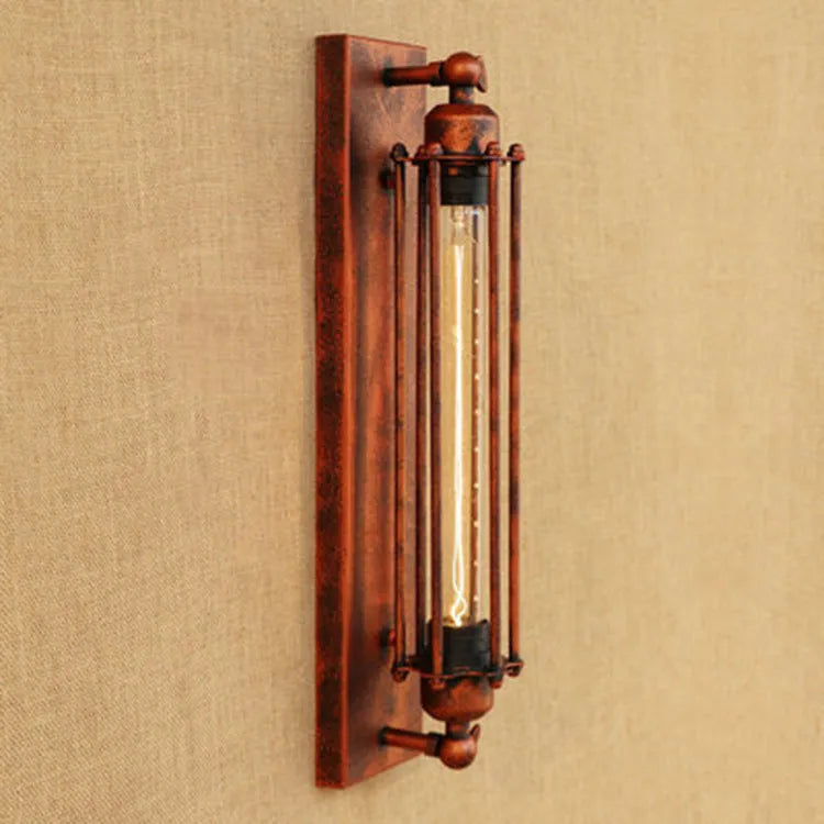 Industrial style retro flute iron wall lamp in silver finish on a wall.