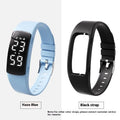 Smart vibration alarm clock watch with coloured silicone strap and LED display on a wrist.