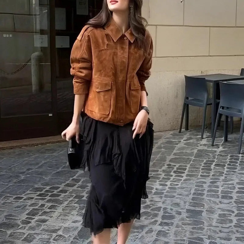 Women's longline brown suede-look polyester coat on a hanger, showing regular sleeves.