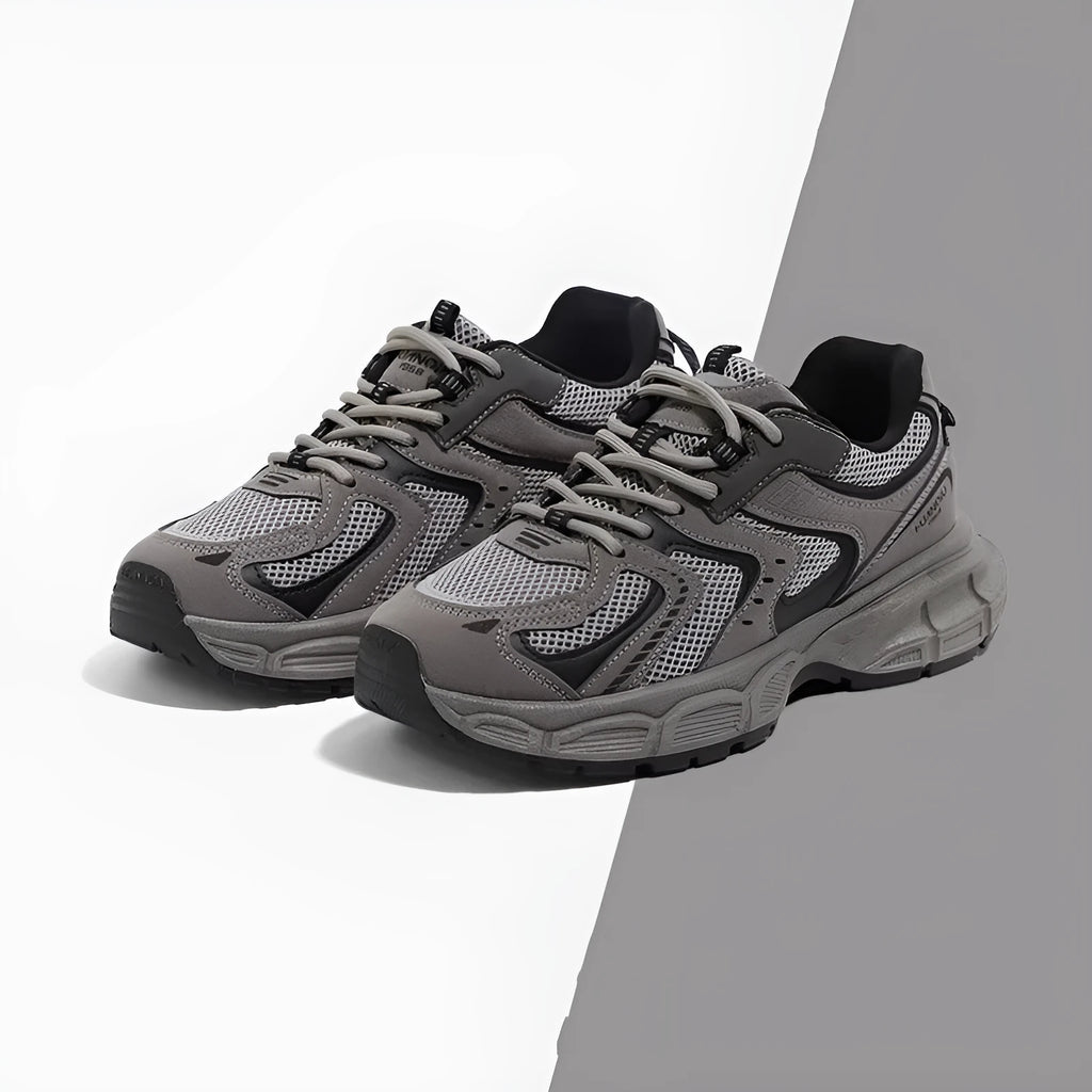 Low-top casual platform sneaker in grey with a round toe, leather stitching, and a flat 3-5cm heel.