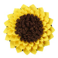 Yellow sunflower-shaped dog snuffle mat with fleece petals for treat hiding and slow feeding