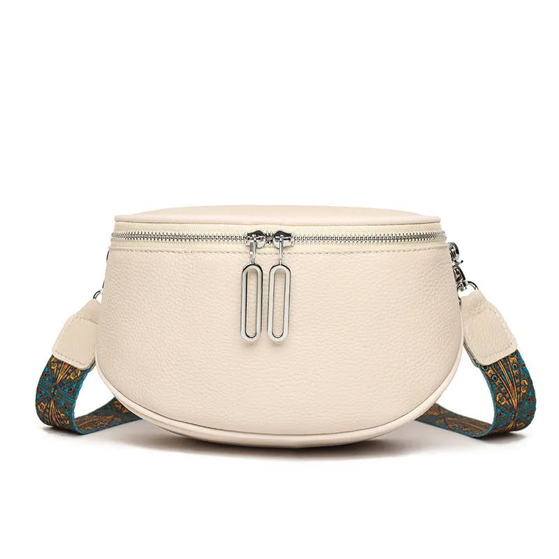 Women's soft PU leather messenger bag in saddle shape with cross-body strap and zipper pocket.