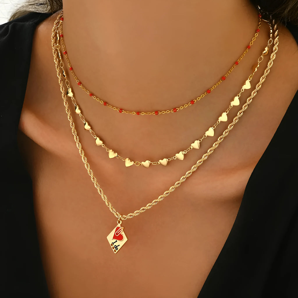 Close-up of a three-layer geometric love pendant on an adjustable zinc alloy clavicle chain.