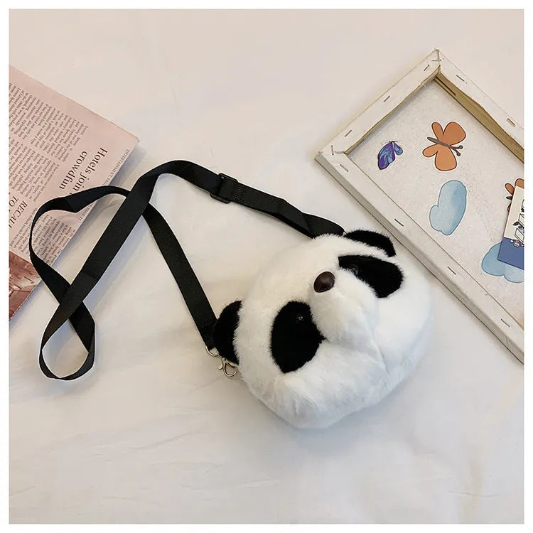 Plush cylindrical crossbody bag with panda head design measuring 18cm by 15cm by 8cm