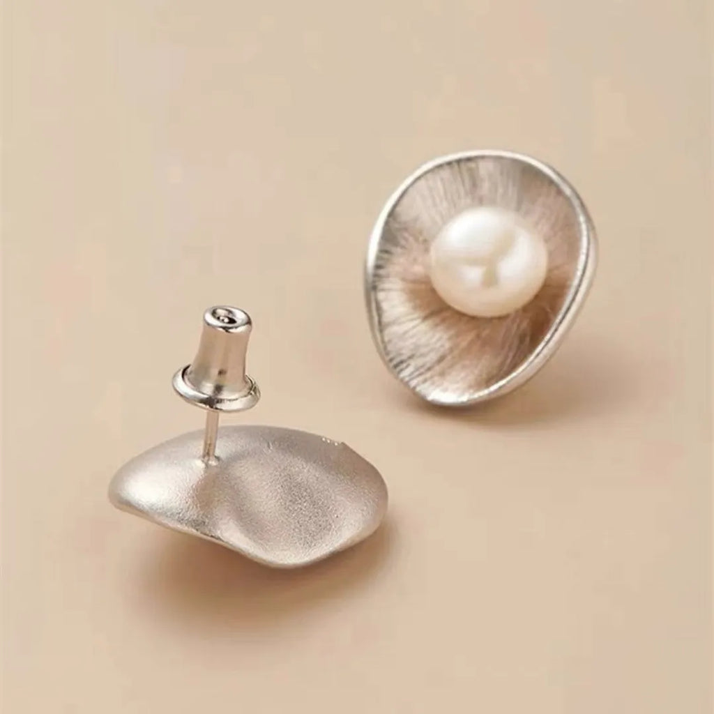 Geometric sterling silver ear studs with pearl elements and electroplated gold finish