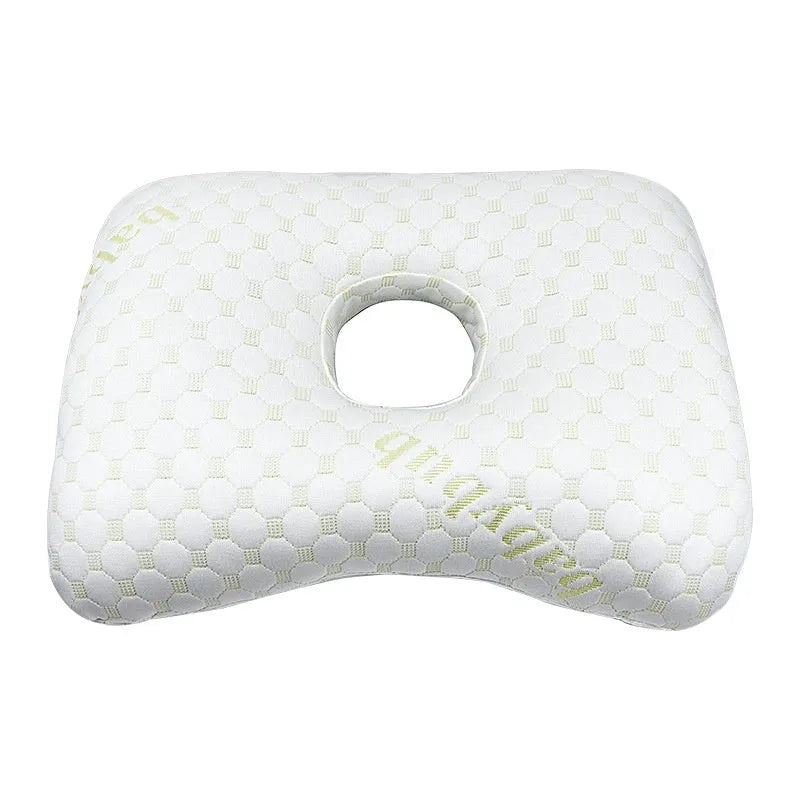 Beauty salon single hole ear pillow for adults in grey colour on a treatment bed.