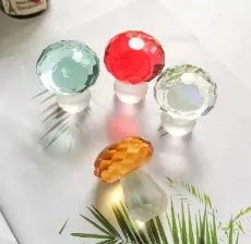 Colourful geometric crystal mushroom decoration on a white background.