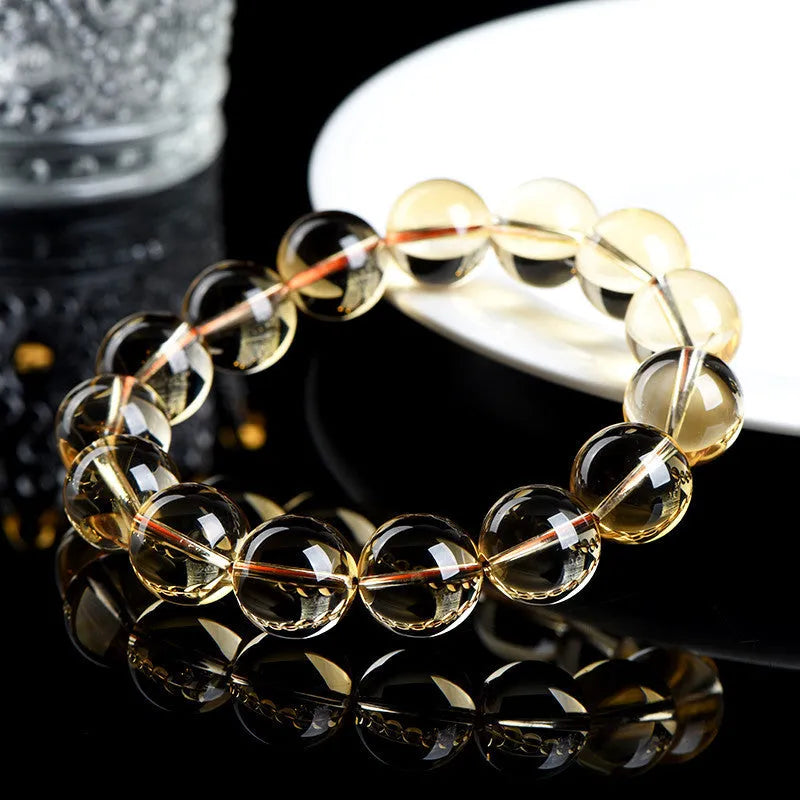 Natural citrine scattered bead bracelet showing original design with polished beads in varying arrangements
