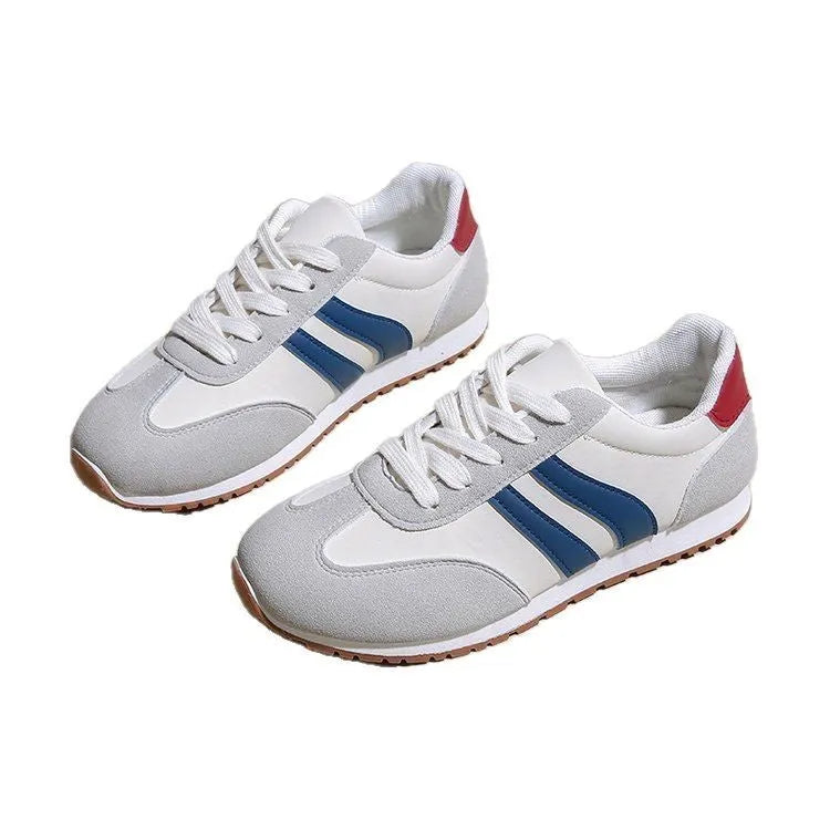Blue and grey leisure sports shoes with Cortez stripes pattern, round toe, and flat rubber sole.